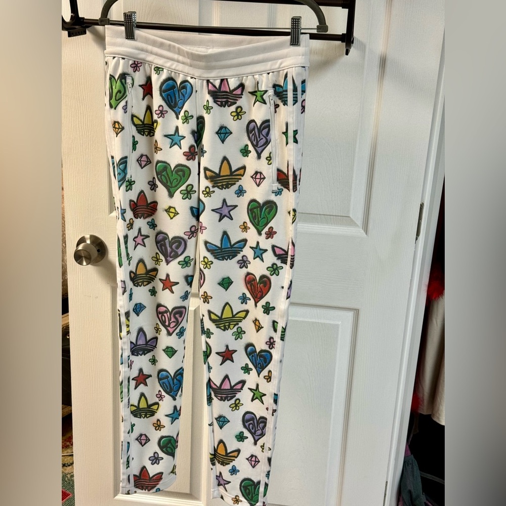 adidas Originals x Jeremy Scott Firebird track pants in all over print in multi